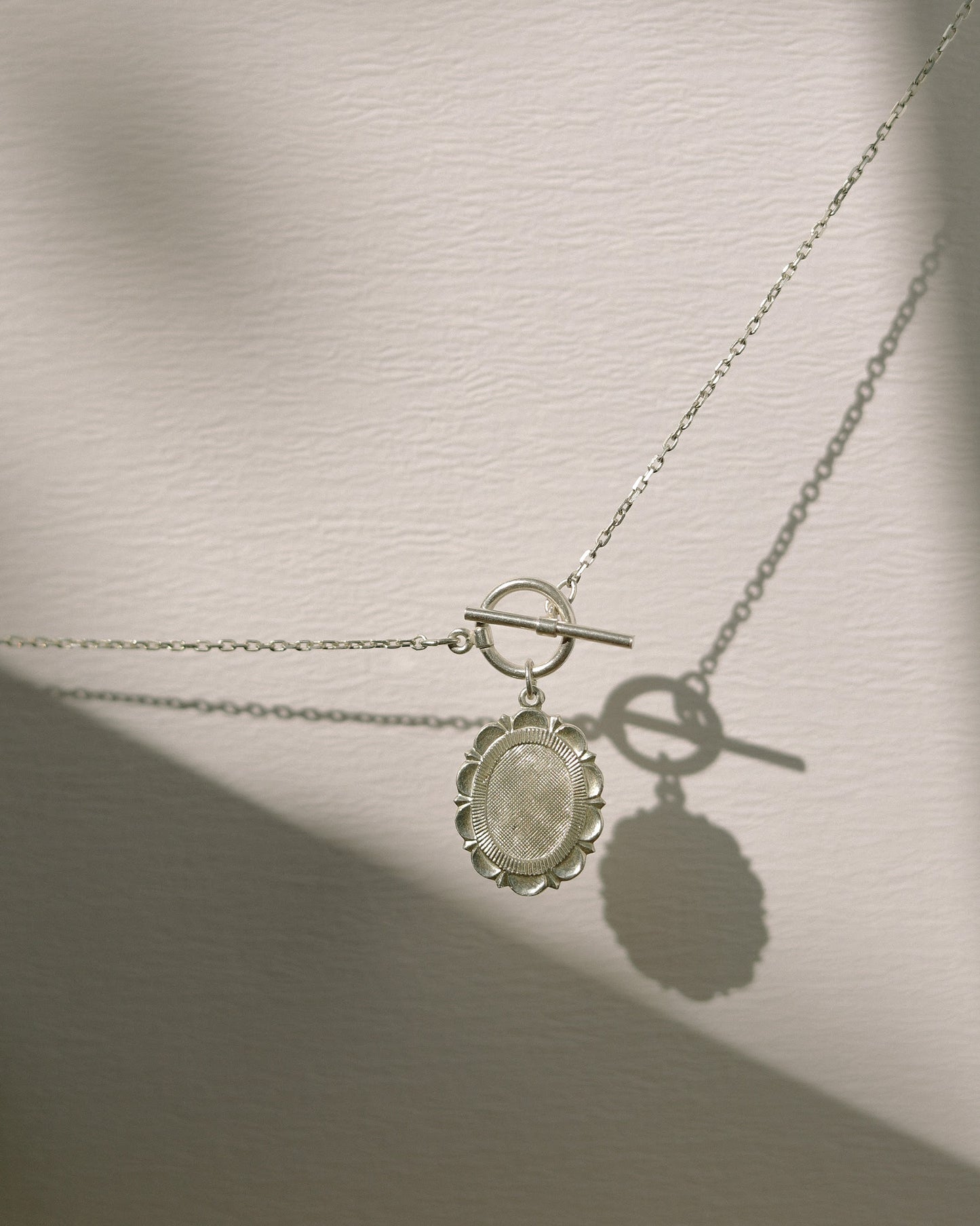 Medallion with toggle clasp