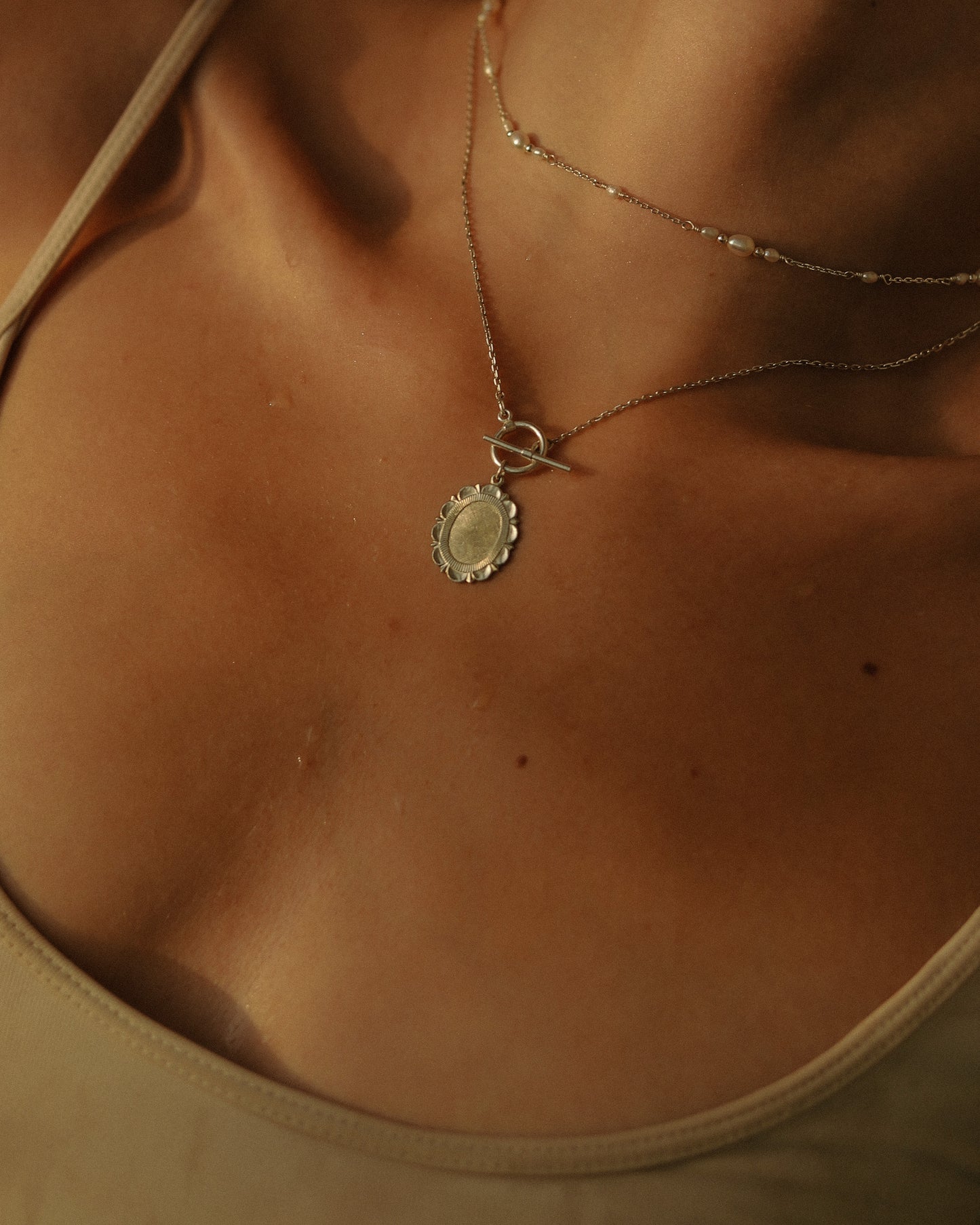 Medallion with toggle clasp
