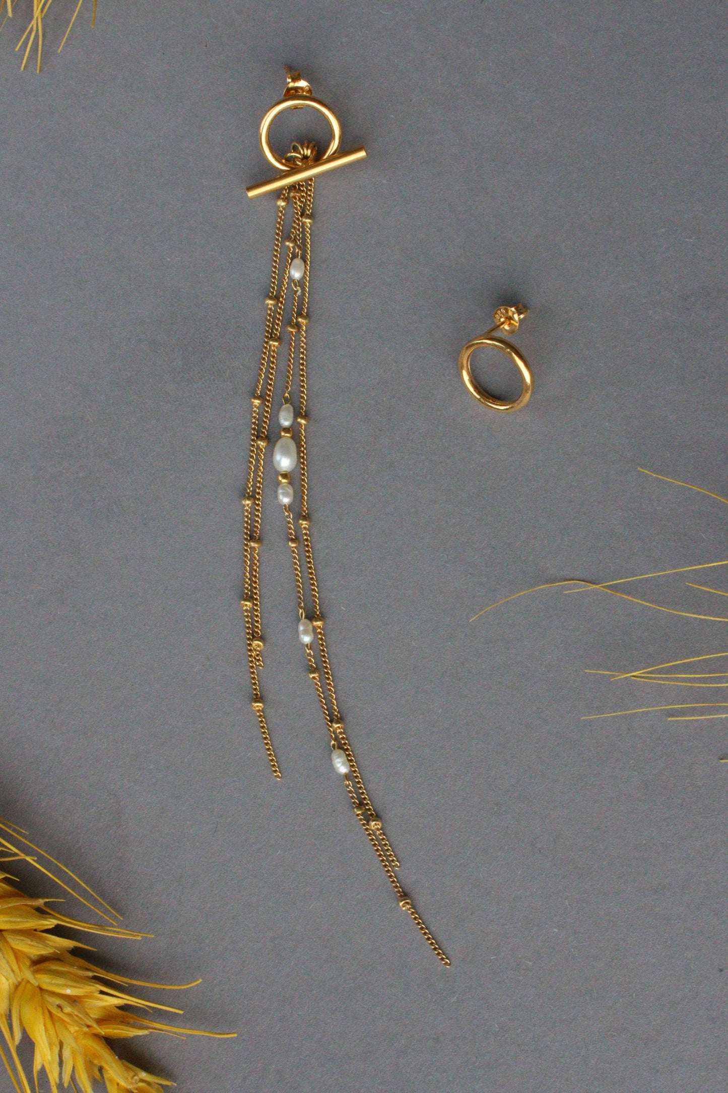 Asymetrical earrings transformers gold