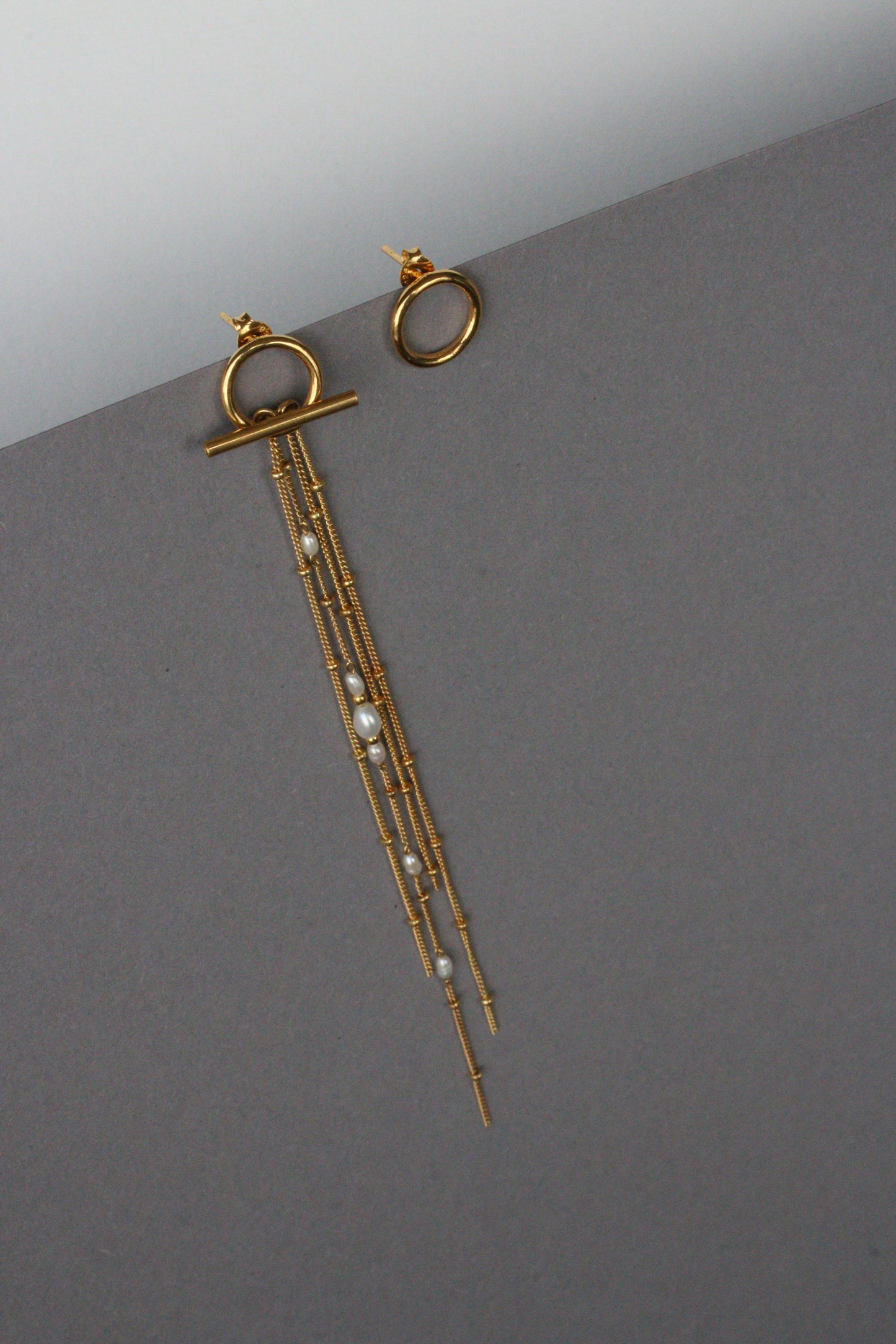 Asymetrical earrings transformers gold
