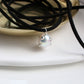 Comet charm on a eco suede string "