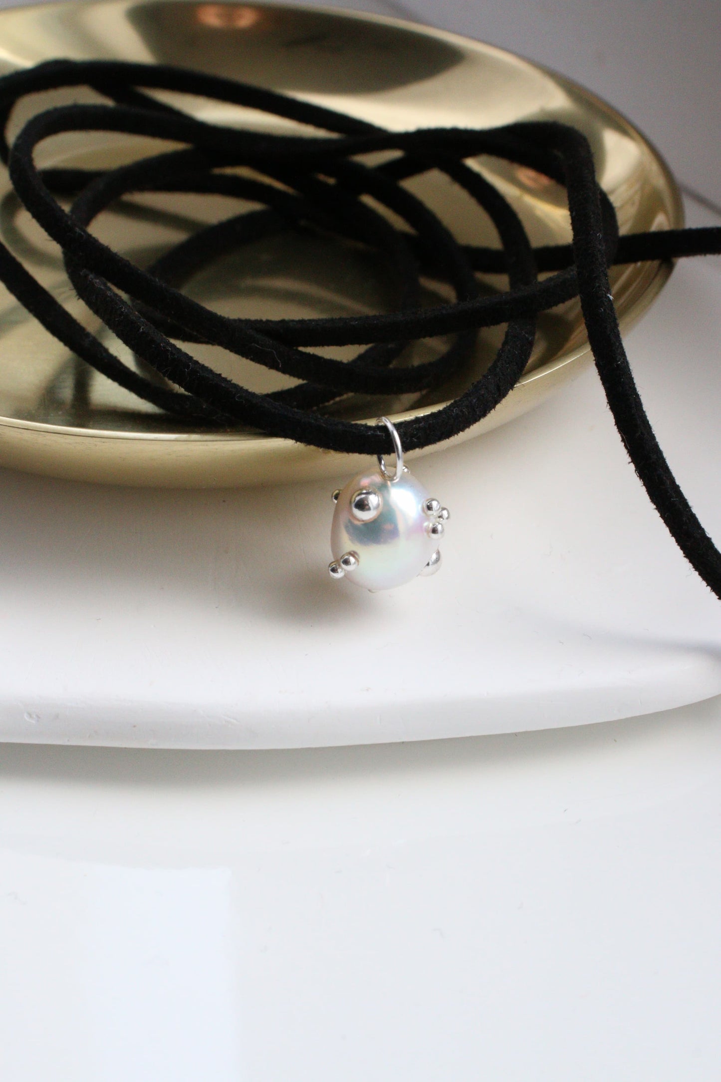 Comet charm on a eco suede string "