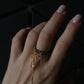 Black pearl ring with chains 